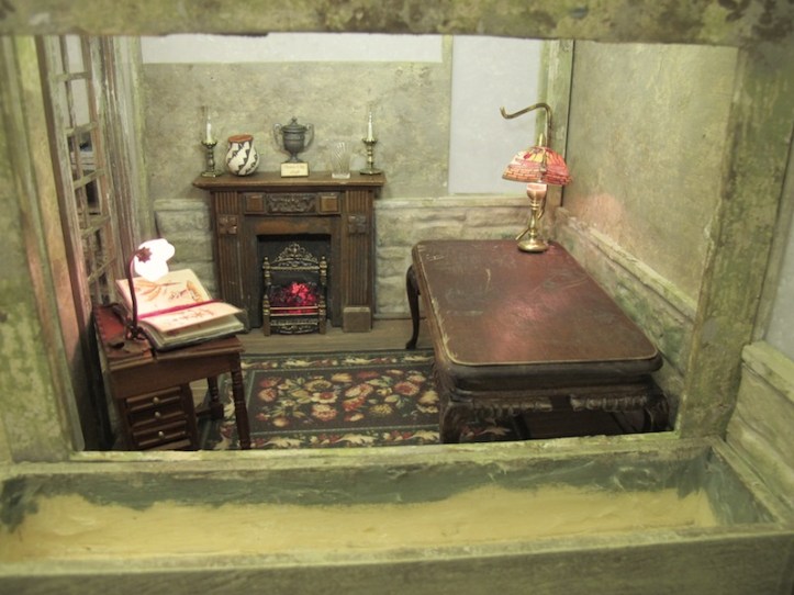 The indoor lighting is wired for Sprout's greenhouse office. There are two table lamps, a hidden LED strip that lights the whole room, and the fireplace flickers.